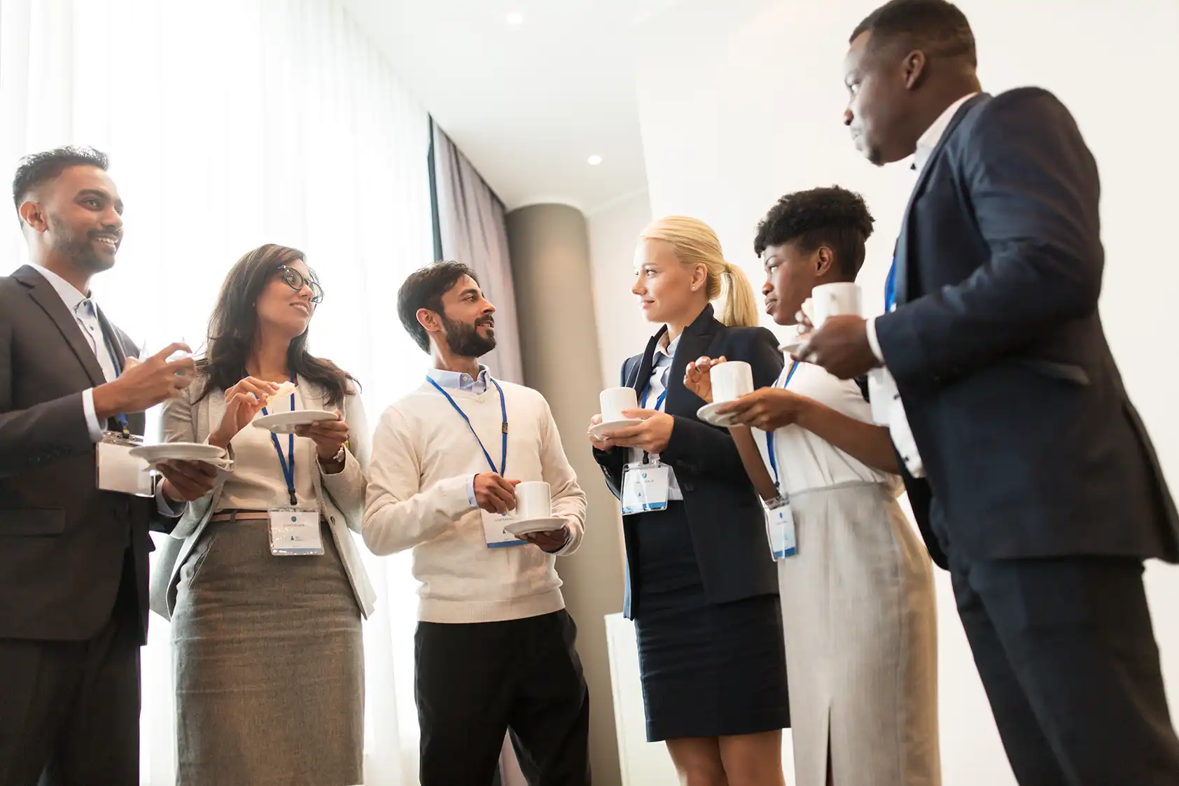 Professionals networking with coffee